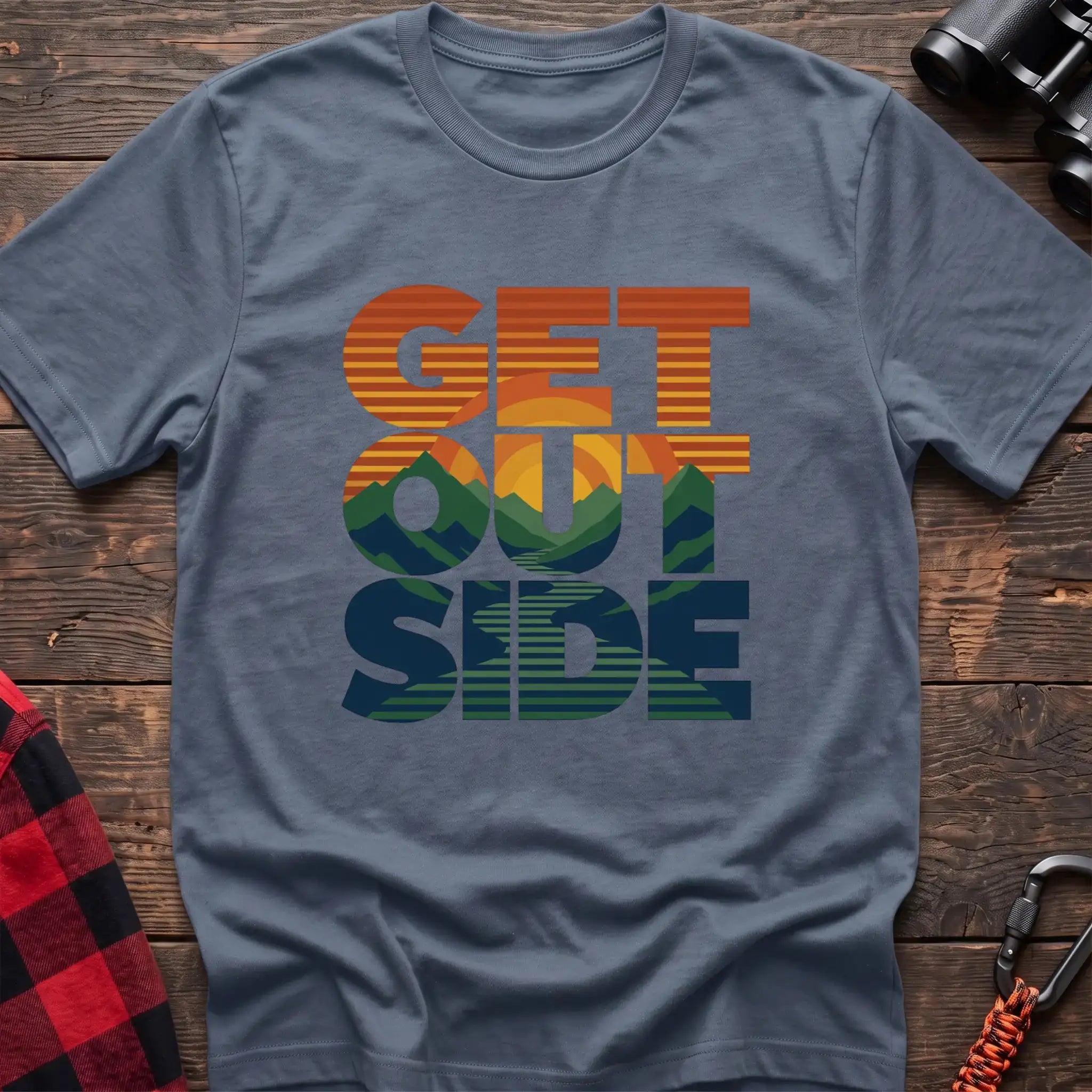 Stone blue t-shirt with retro sunset and mountain graphic integrated into the text Get Outside