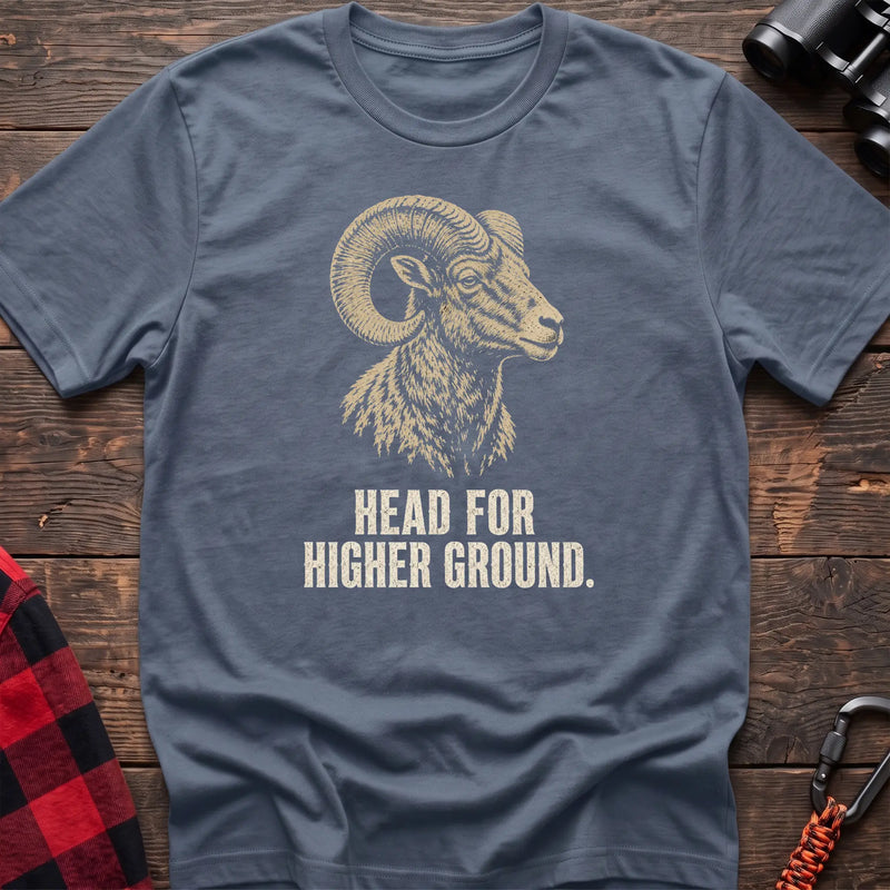 Stone blue cotton t-shirt with a bighorn ram graphic and Head for Higher Ground text on rustic wood