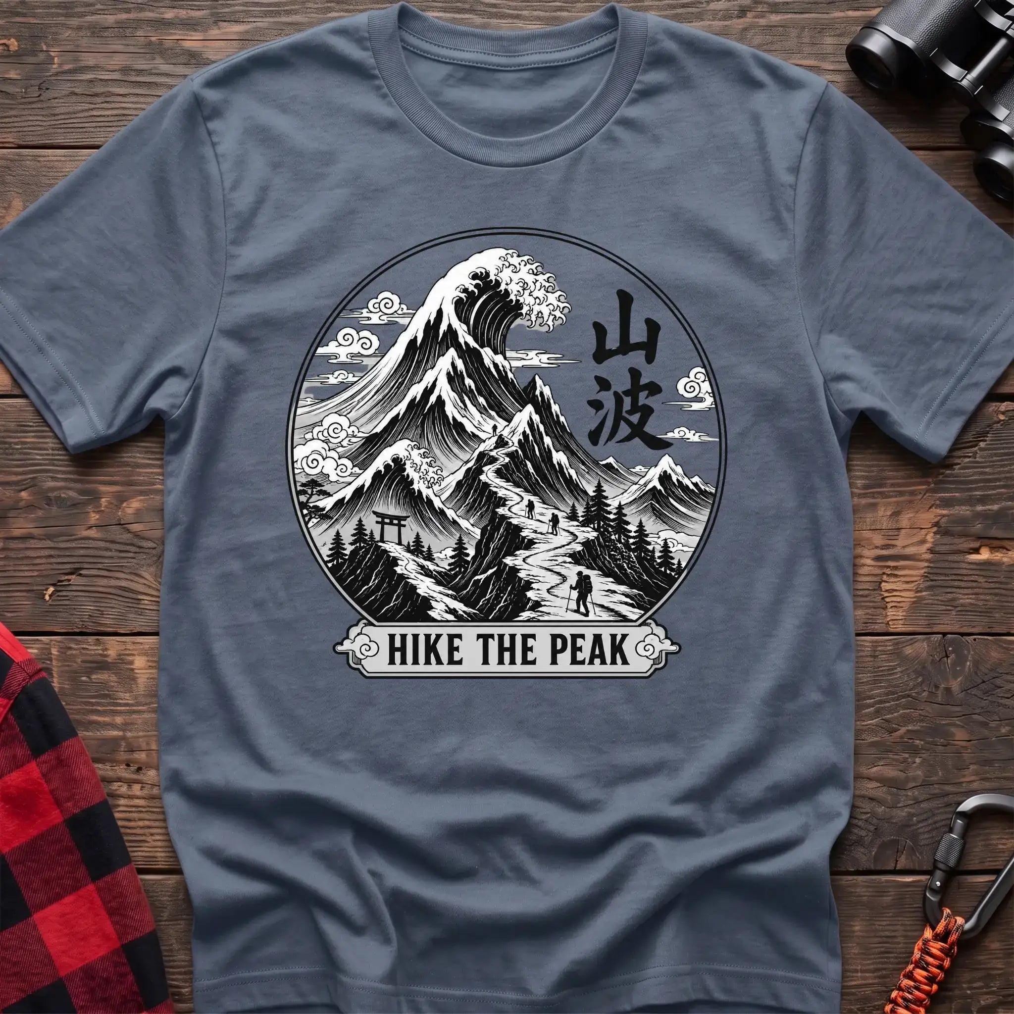 Stone blue t-shirt with circular Japanese-style mountain and wave graphic featuring hikers and the text Hike the Peak