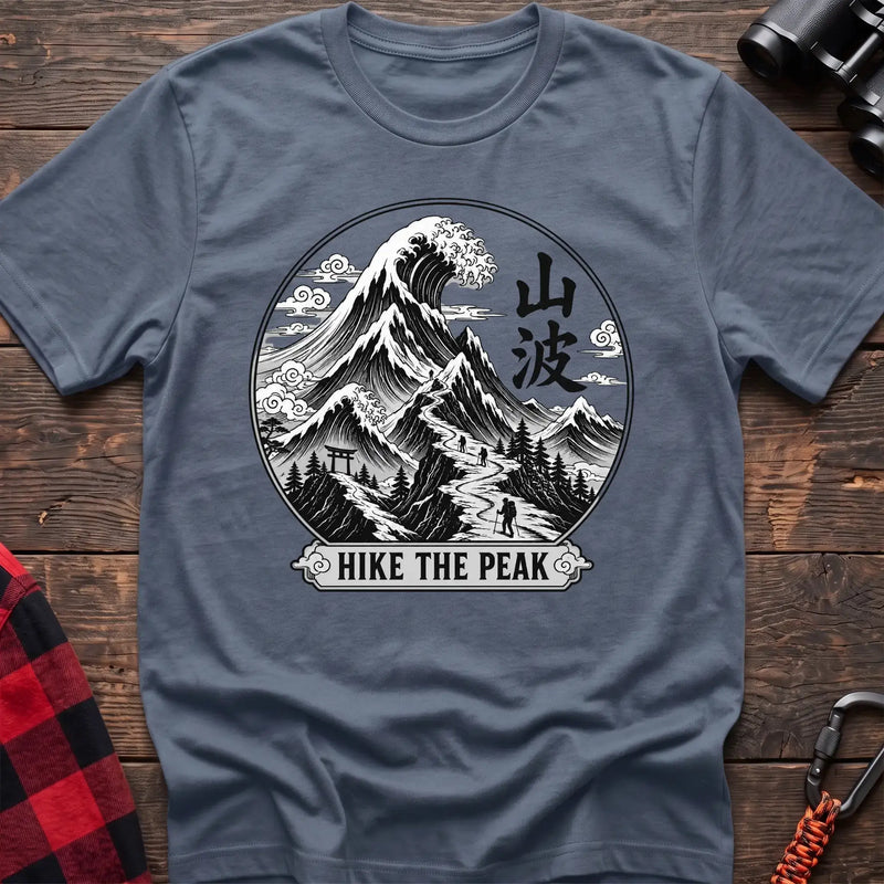 Stone blue t-shirt with circular Japanese-style mountain and wave graphic featuring hikers and the text Hike the Peak