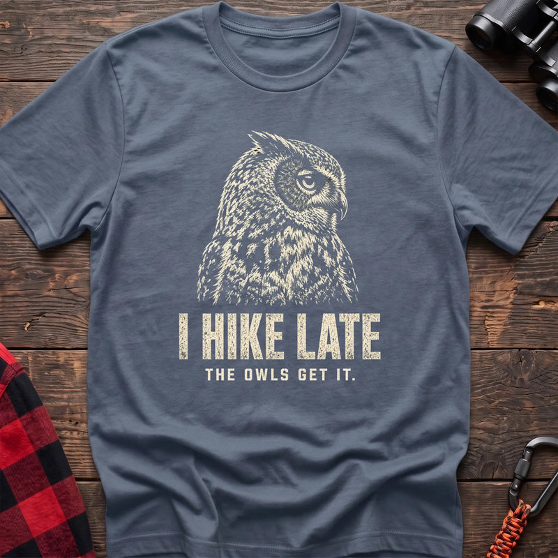 Stone blue cotton t-shirt with an owl graphic and I Hike Late The Owls Get It text on rustic wood