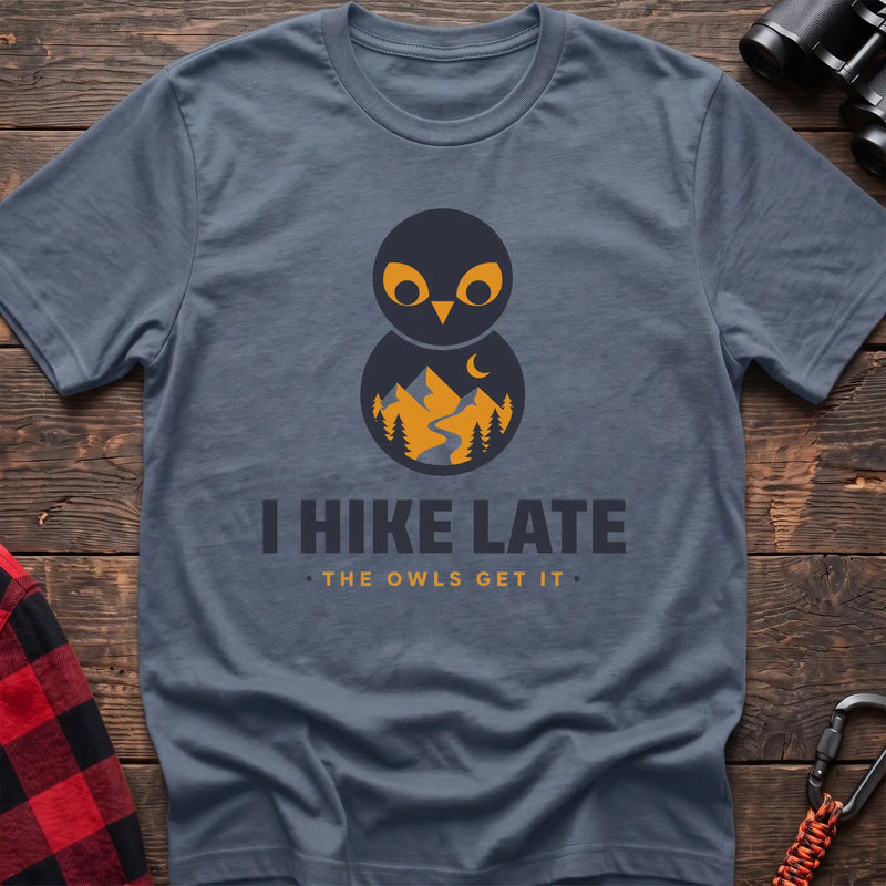 Stone blue hiking t-shirt with stacked owl graphic and the text “I Hike Late The Owls Get It”