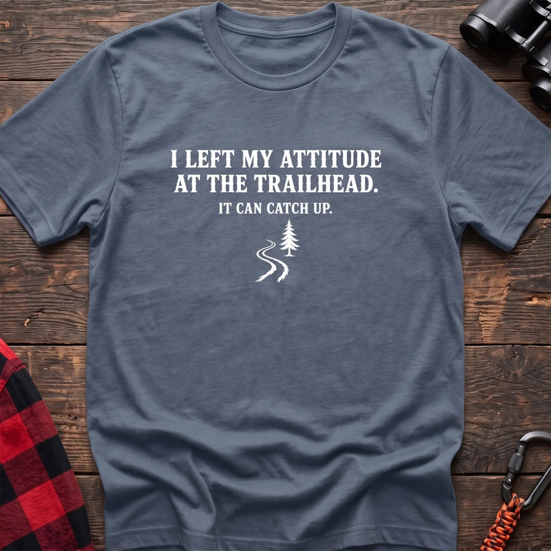 Stone blue cotton t-shirt with a trail graphic and I Left My Attitude at the Trailhead It Can Catch Up text on rustic wood