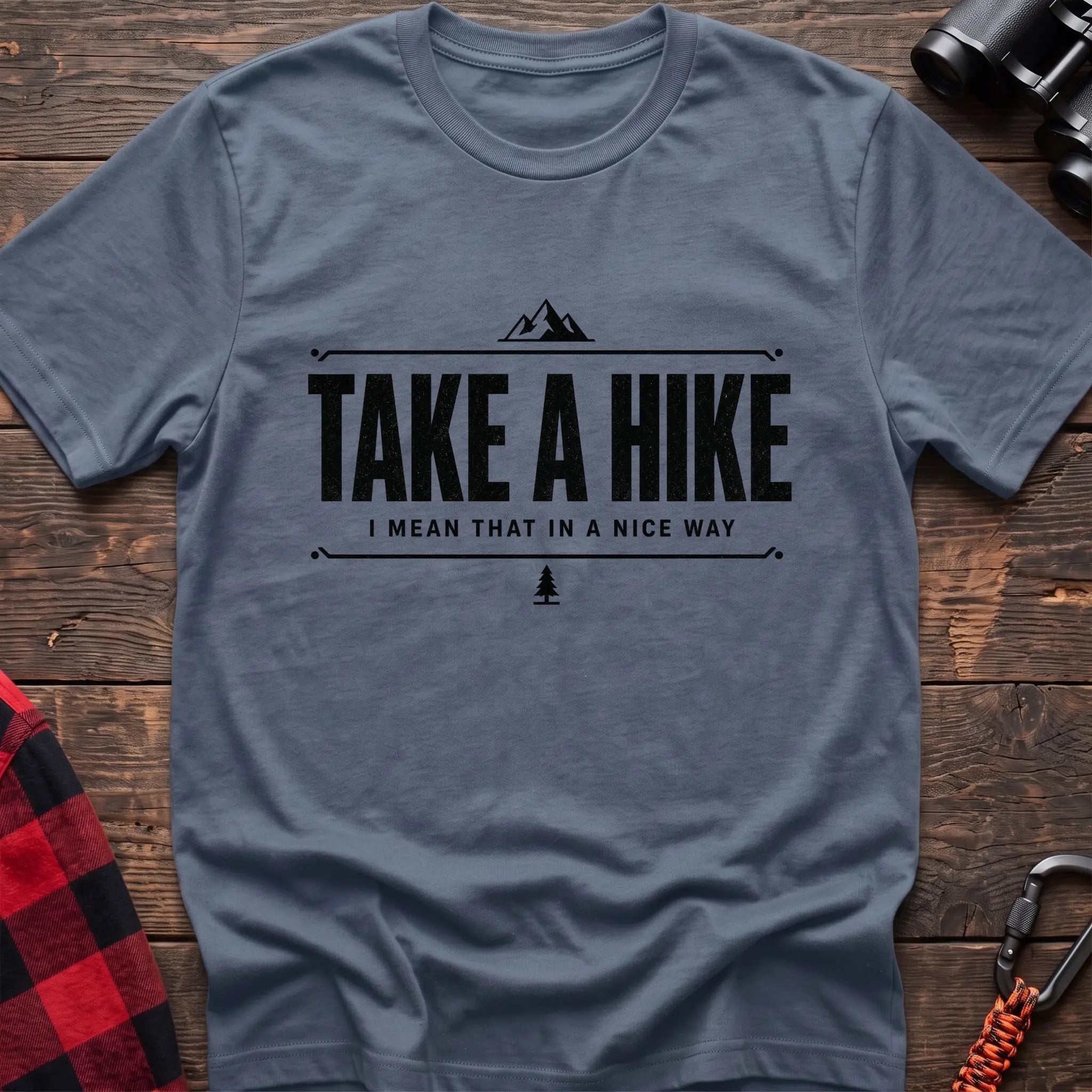 Stone blue cotton hiking t-shirt with "Take a Hike I Mean That in a Nice Way" quote, mountain icon, and pine tree graphic
