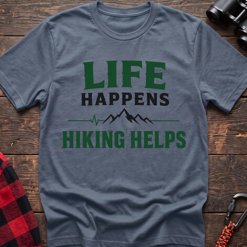 Stone blue cotton t-shirt with a mountain heartbeat graphic and Life Happens Hiking Helps text on rustic wood