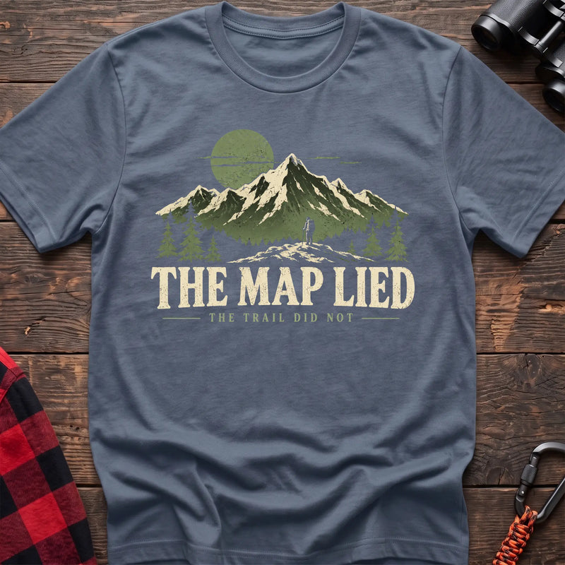 Stone blue cotton t-shirt with a hiker and mountain graphic and The Map Lied The Trail Did Not text on rustic wood