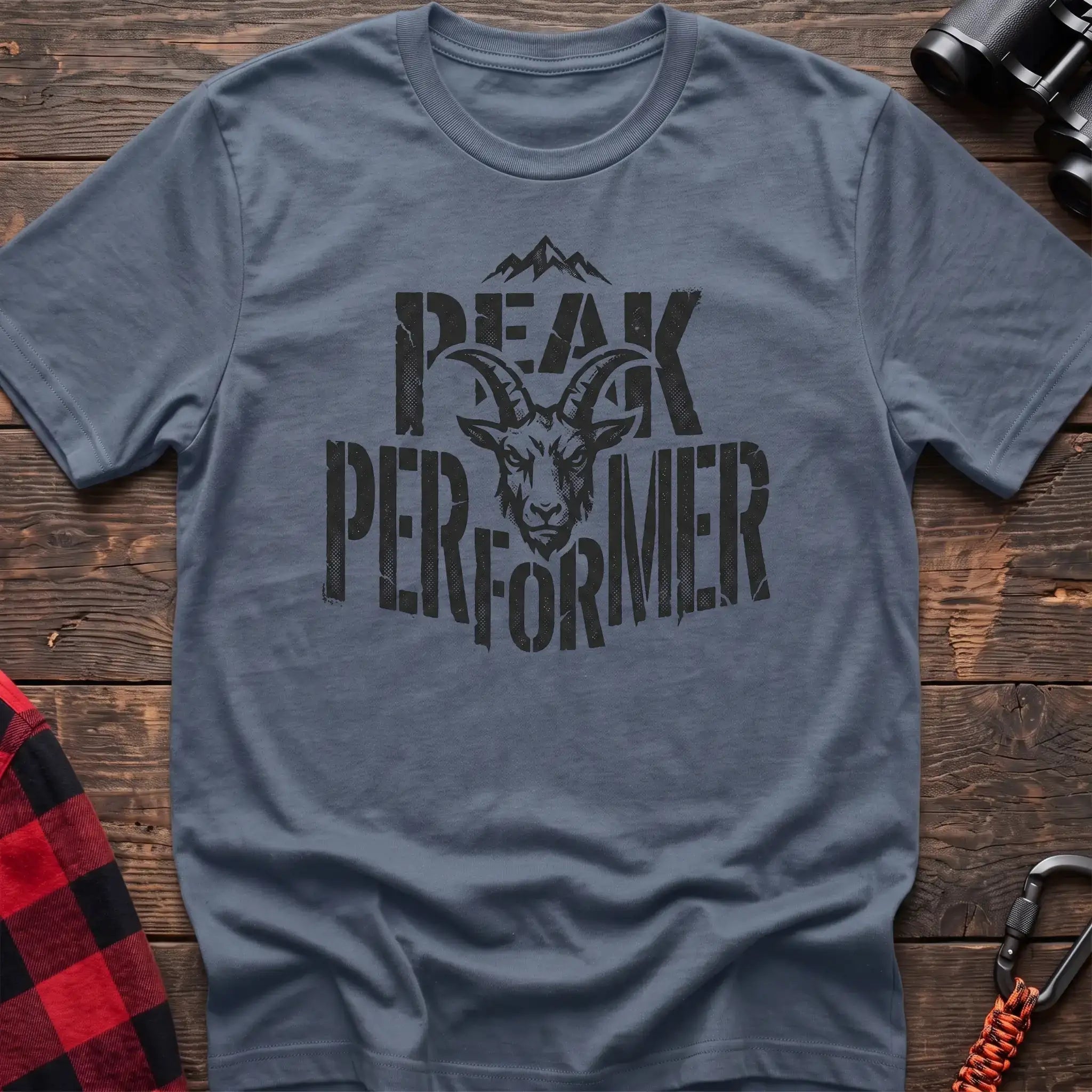 Stone blue t-shirt with mountain goat head graphic and the text Peak Performer