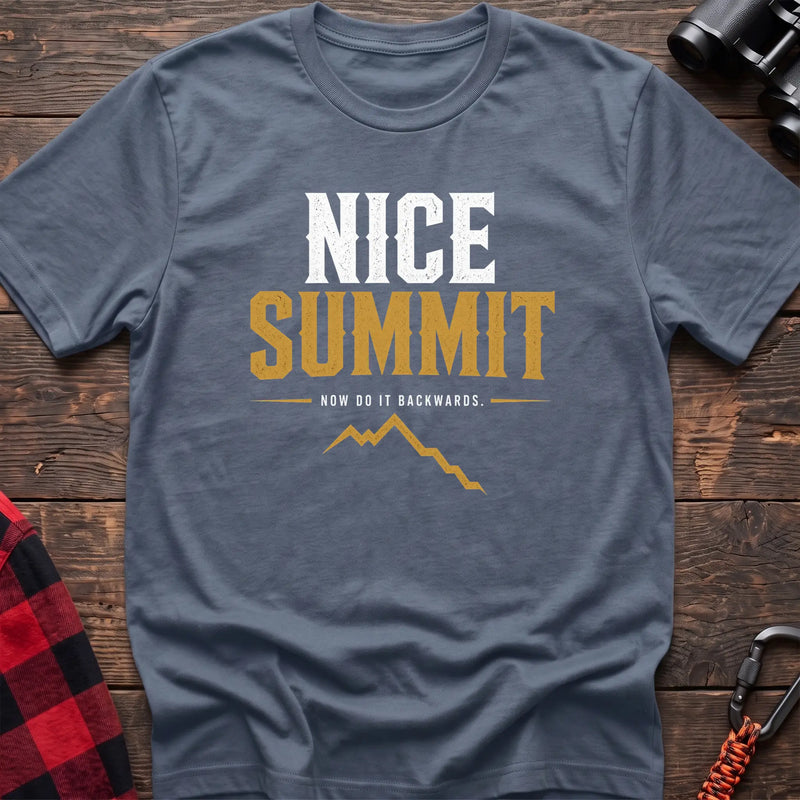 Stone blue cotton t-shirt with a mountain graphic and Nice Summit Now Do It Backwards text on rustic wood