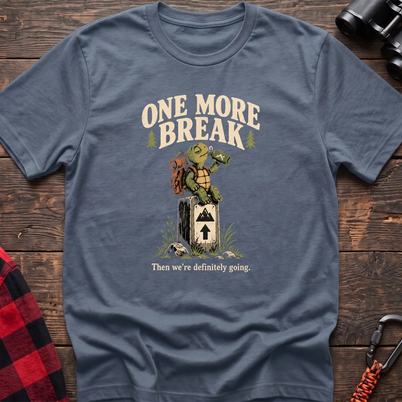Stone blue cotton t-shirt with a hiking turtle graphic and One More Break text on rustic wood