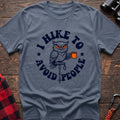 Stone blue t-shirt with owl holding a camping mug on a hiking pole and the text I Hike to Avoid People