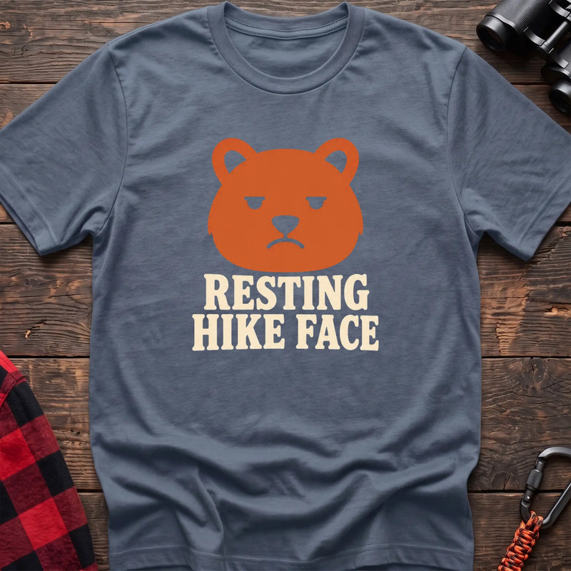 Stone blue cotton t-shirt with a grumpy bear graphic and Resting Hike Face text on rustic wood