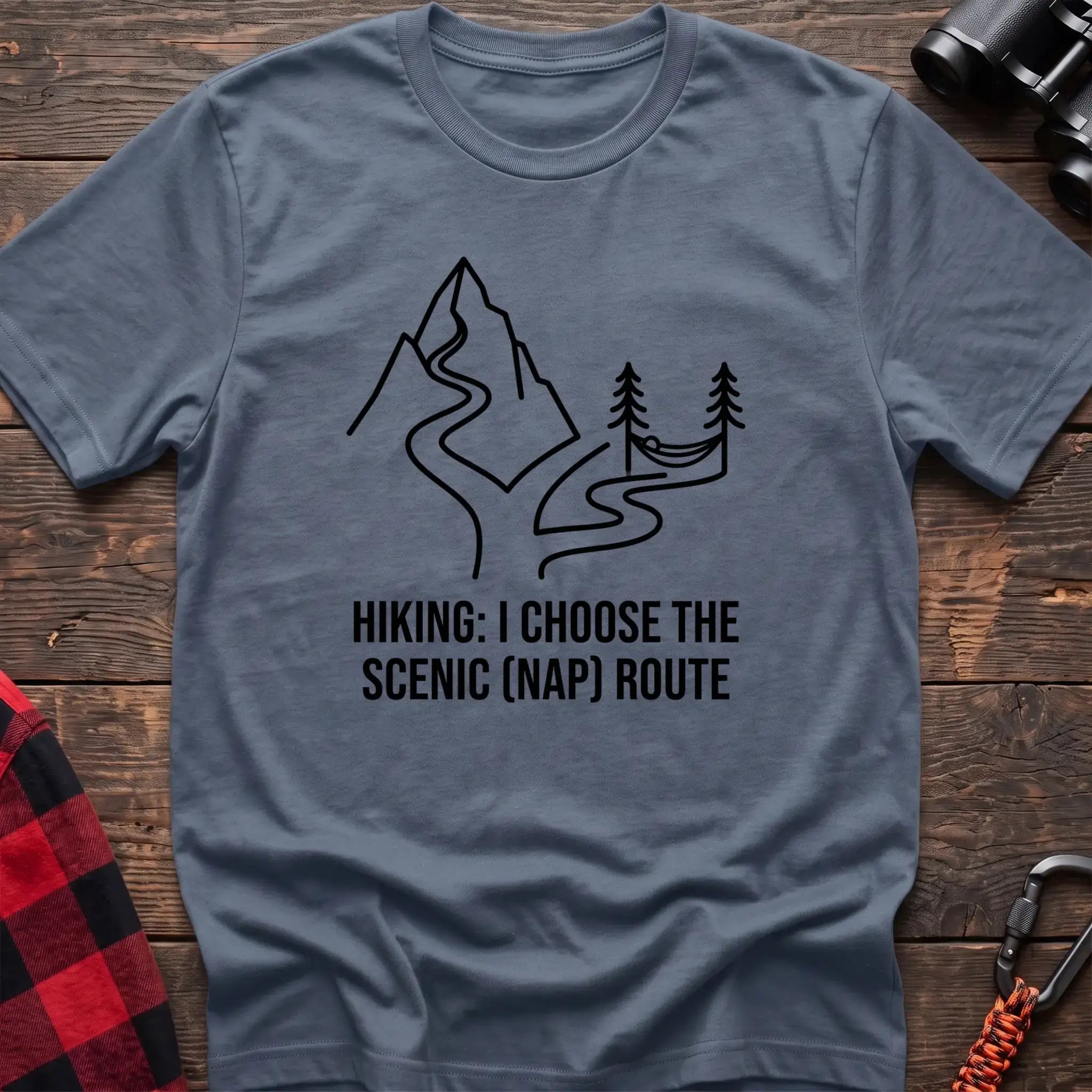 Stone blue t-shirt with minimalist mountain trail and hammock graphic reading Hiking I Choose the Scenic Nap Route
