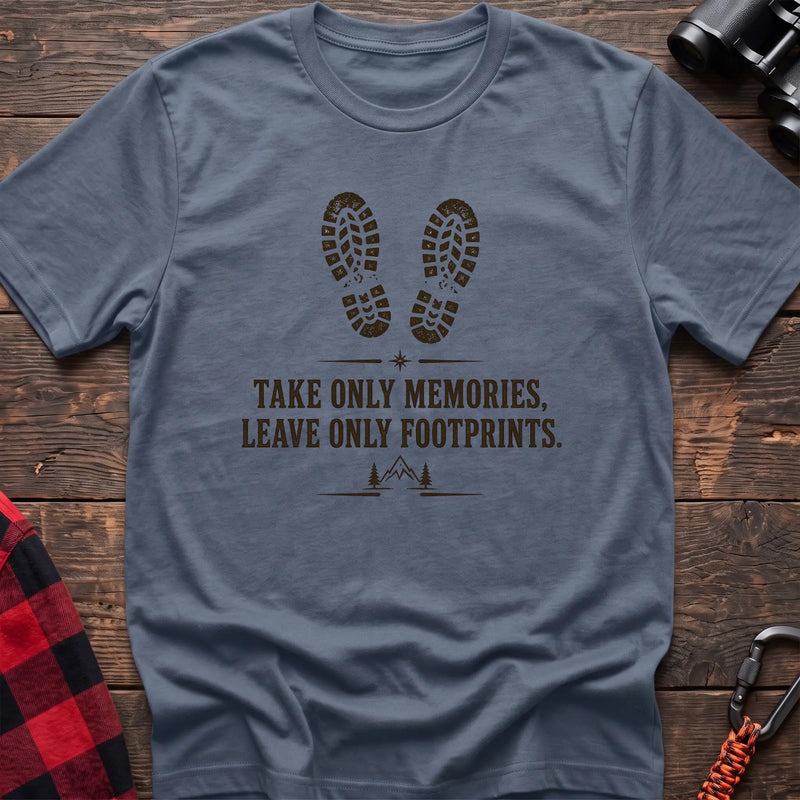 Stone blue hiking graphic T-shirt with boot prints and “Take only memories, leave only footprints” trail design