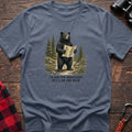 Stone blue cotton t-shirt with a bear holding a map graphic and I’d Ask for Directions But I Am the Bear text on rustic wood