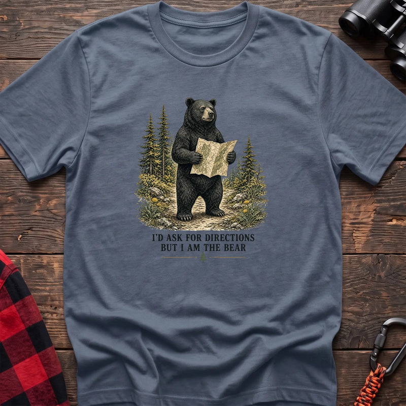 Stone blue cotton t-shirt with a bear holding a map graphic and I’d Ask for Directions But I Am the Bear text on rustic wood