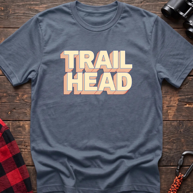 Black cotton t-shirt with retro stacked Trail Head text on rustic wood