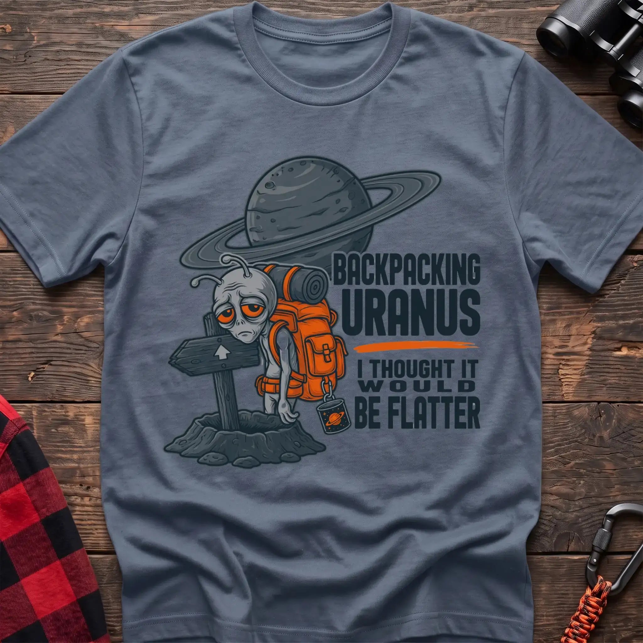 Stone blue t-shirt with tired alien backpacker next to a trail sign and the text Backpacking Uranus I Thought It Would Be Flatter
