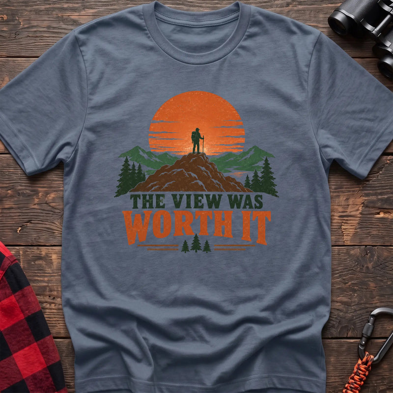 Stone blue cotton t-shirt with a hiker on a mountain sunset graphic and The View Was Worth It text on rustic wood