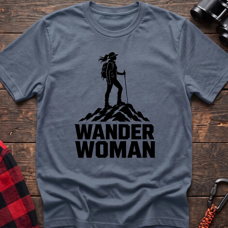 Stone blue cotton hiking t-shirt with black silhouette of a female hiker on a mountain peak and bold Wander Woman text
