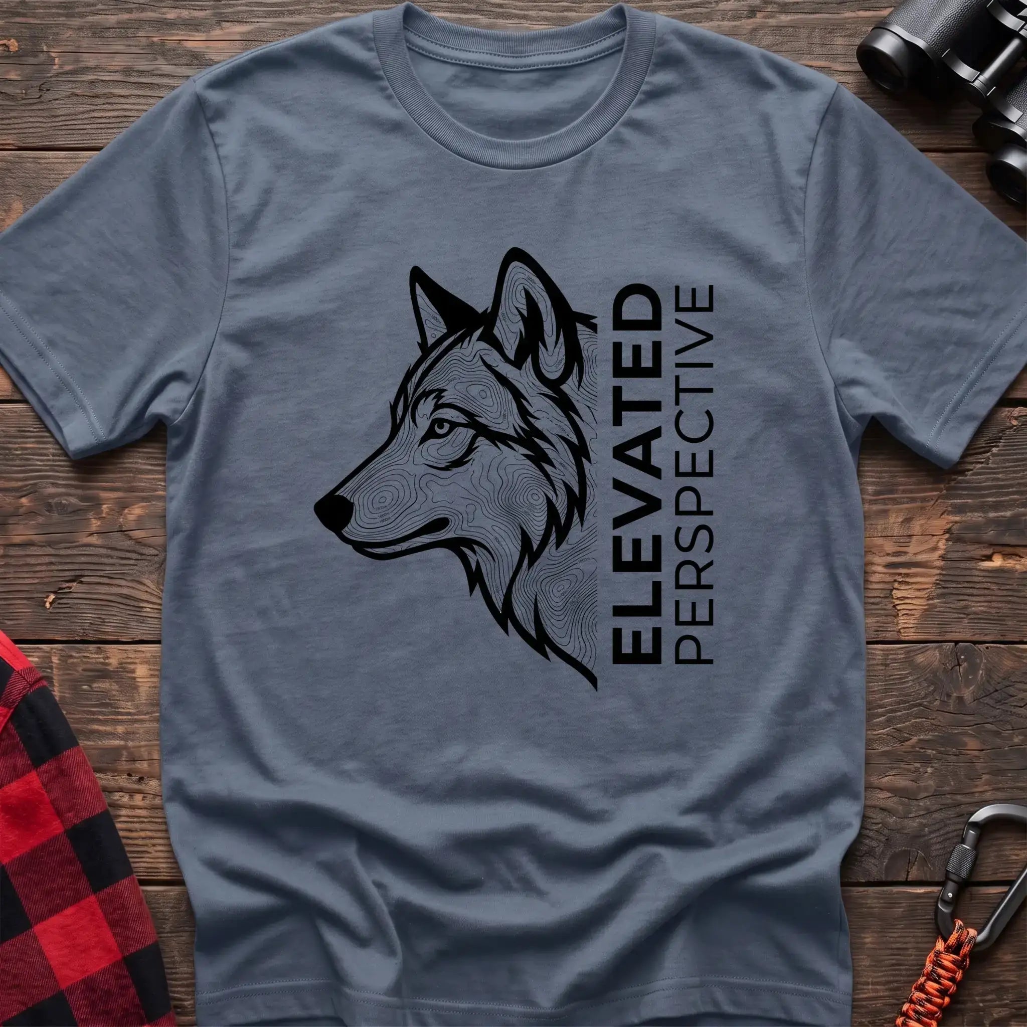 Stone blue t-shirt with topographic wolf head graphic and vertical text Elevated Perspective