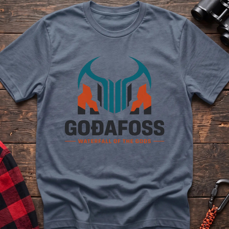 Stone blue cotton t-shirt with a basalt column graphic and Svartifoss Basalt and Bad Weather text on rustic wood
