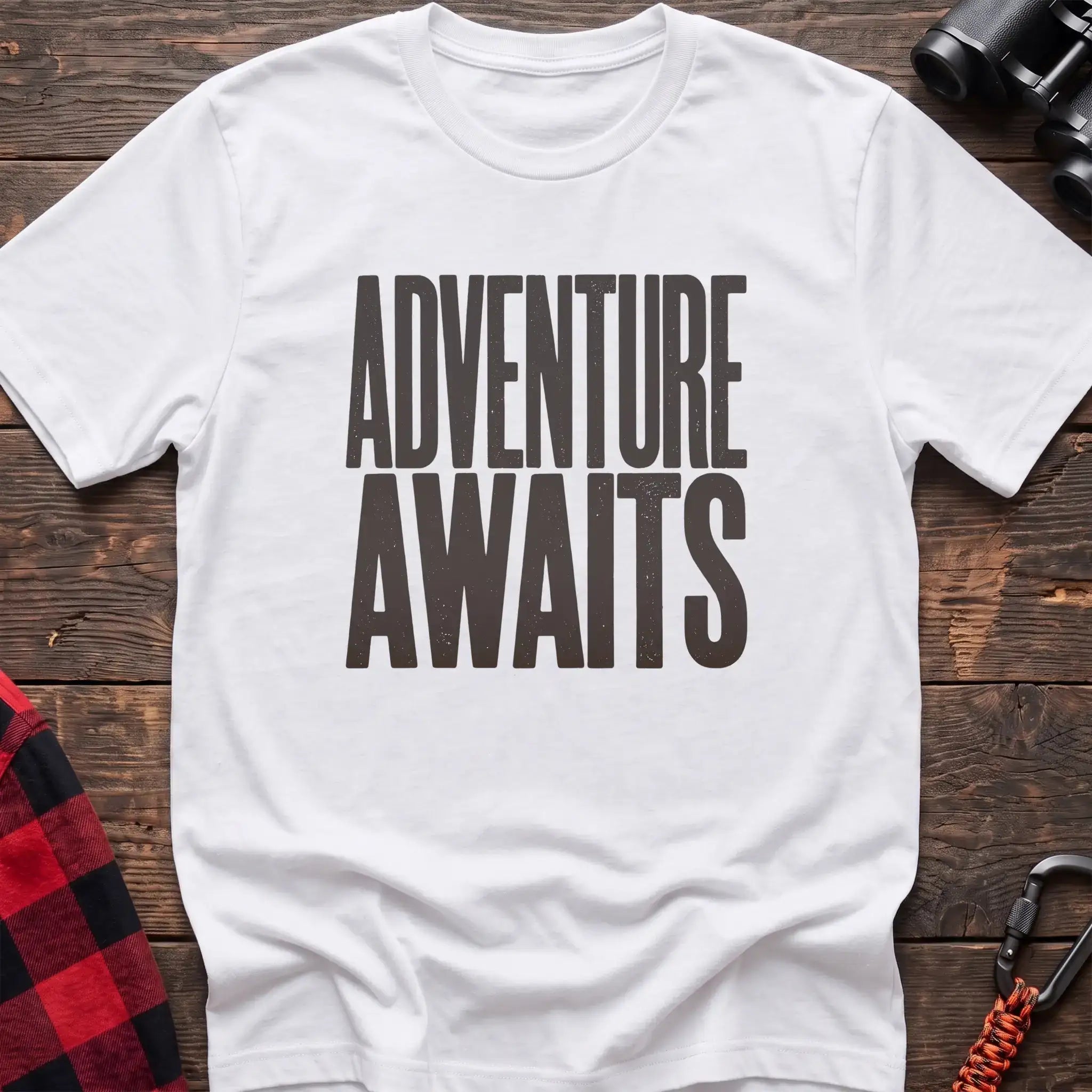 White t-shirt with large distressed gray text reading Adventure Awaits