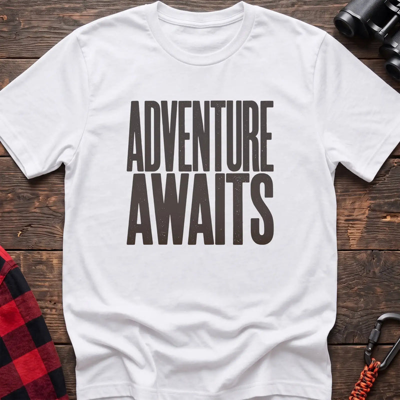 White t-shirt with large distressed gray text reading Adventure Awaits