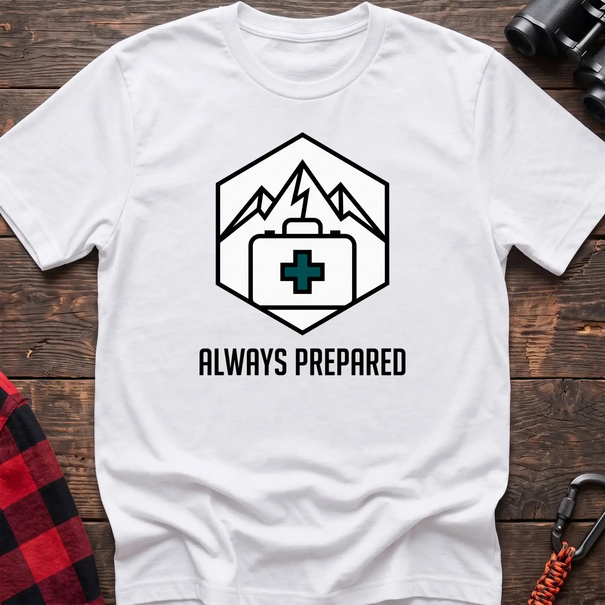 White t-shirt with hexagonal badge graphic of mountains and a first aid kit, reading Always Prepared