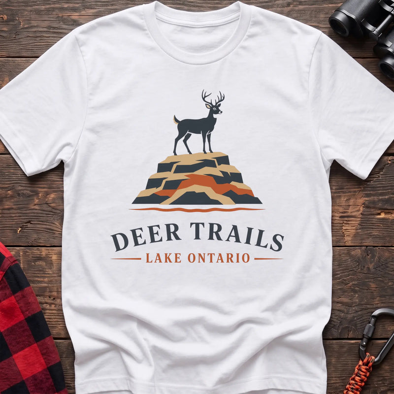 White hiking t-shirt with a deer on a rocky bluff and the text “Deer Trails Lake Ontario”