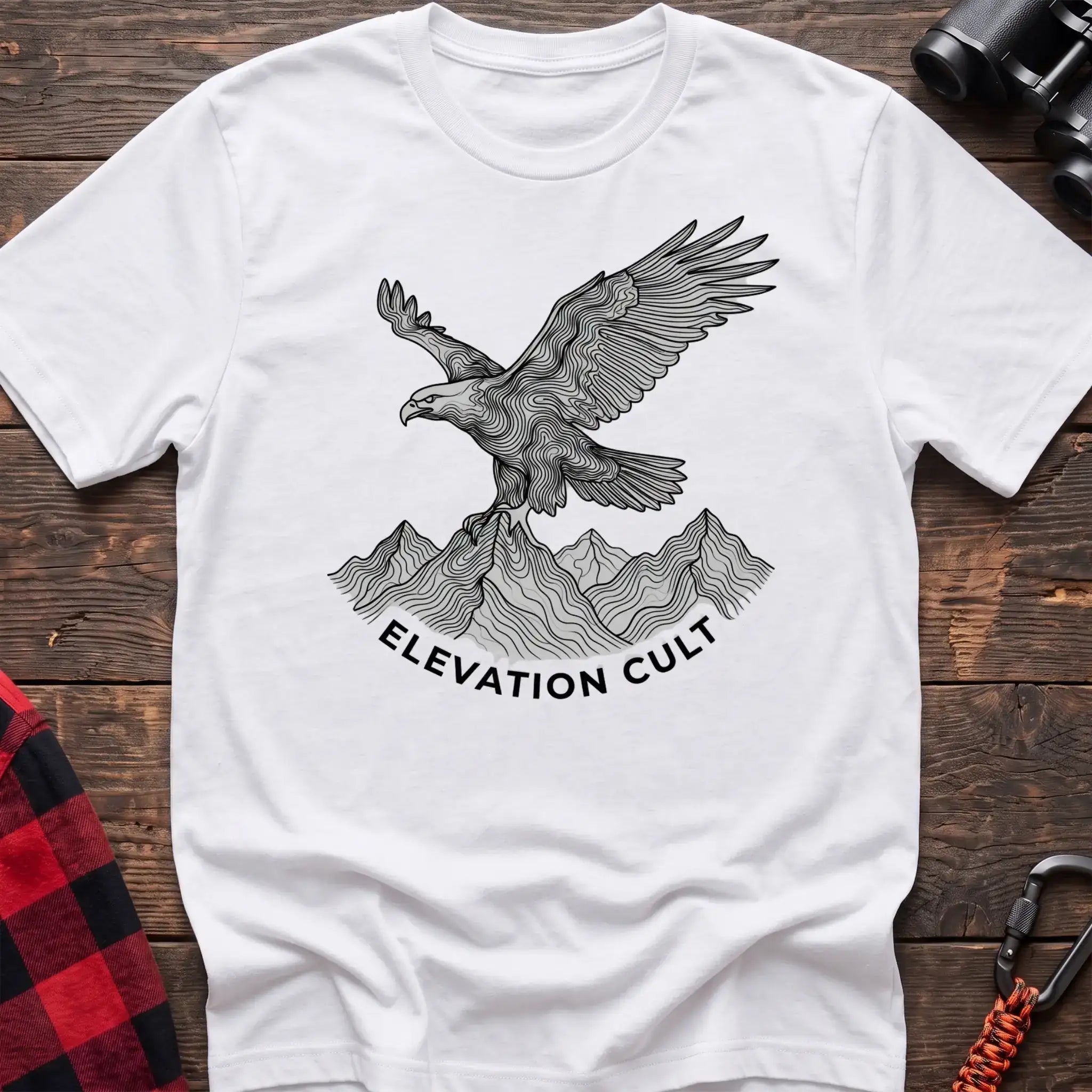 White t-shirt with detailed eagle perched on mountains graphic and the text Elevation Cult