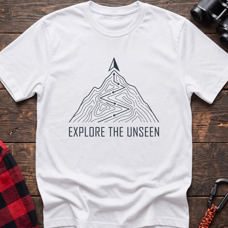 White t-shirt with topographic mountain trail graphic and the text Explore the Unseen