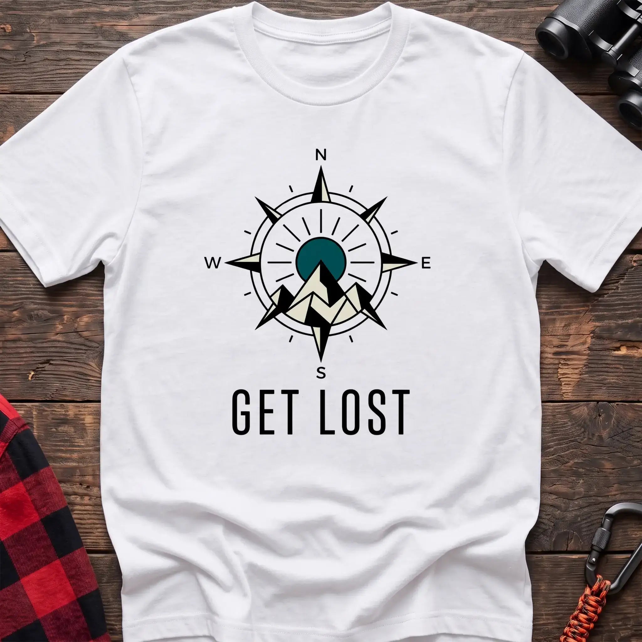 White t-shirt with compass rose graphic featuring mountains in the center and the text Get Lost