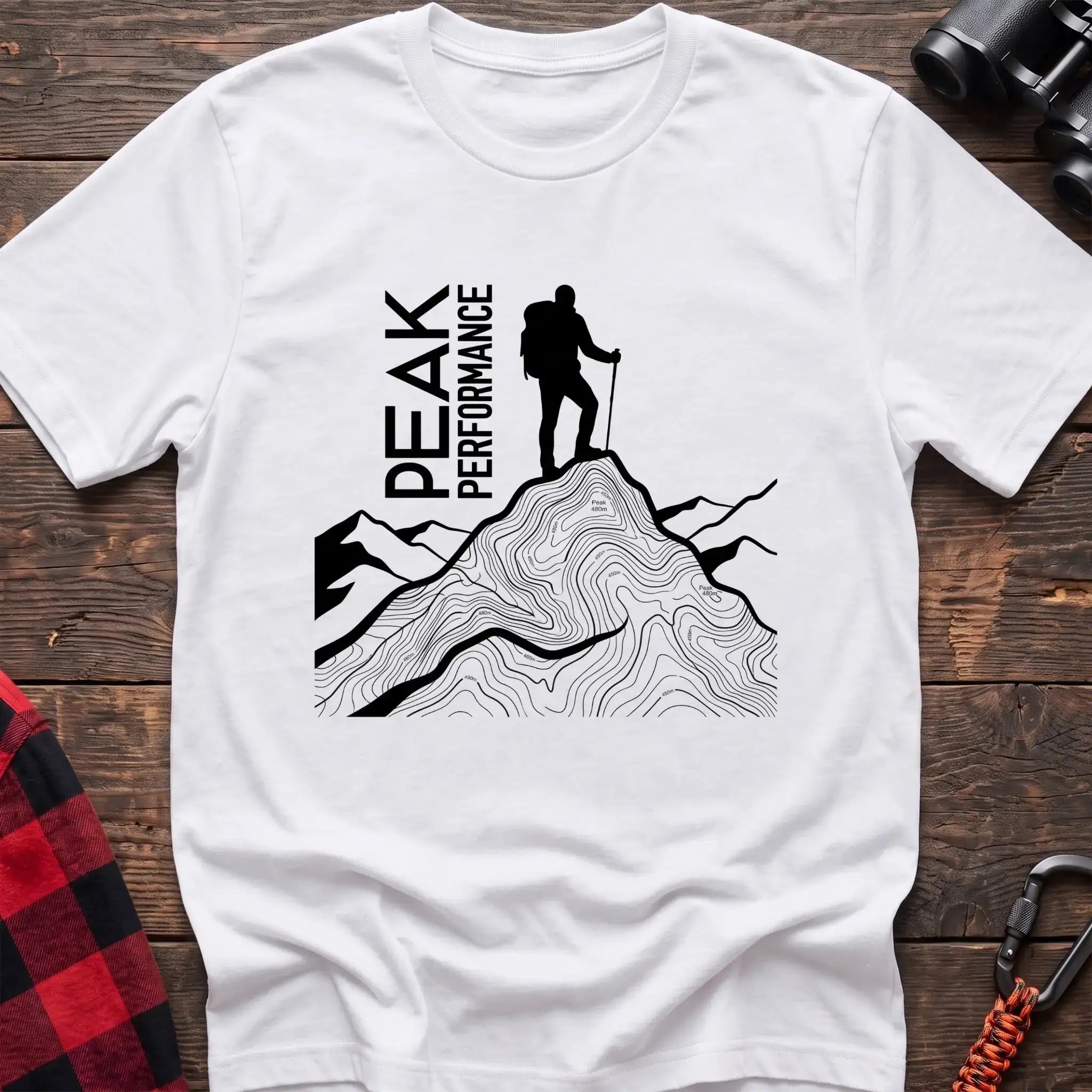 White t-shirt with hiker silhouette on a topographic mountain peak and the text Peak Performance