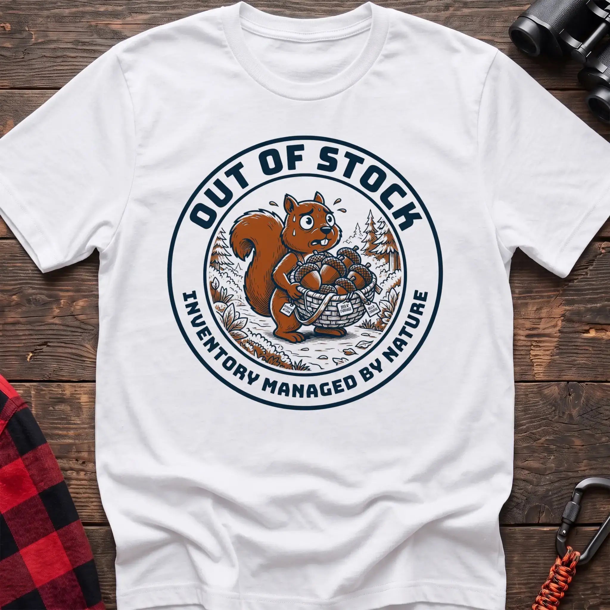 White t-shirt with circular graphic of a stressed squirrel holding a basket of acorns, reading Out of Stock Inventory Managed by Nature