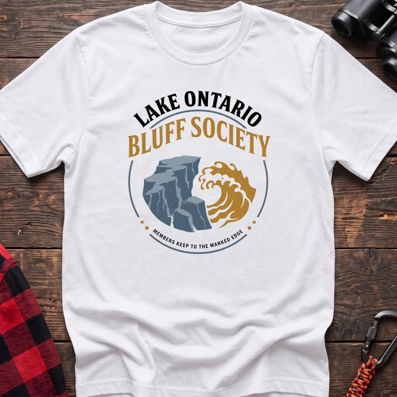 White hiking t-shirt with Lake Ontario Bluff Society badge showing a cliff, wave, and Members Keep to the Marked Edge