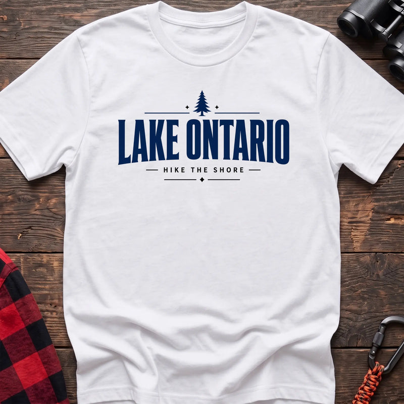 White cotton hiking t-shirt with pine tree icon and "Lake Ontario hike the shore" text