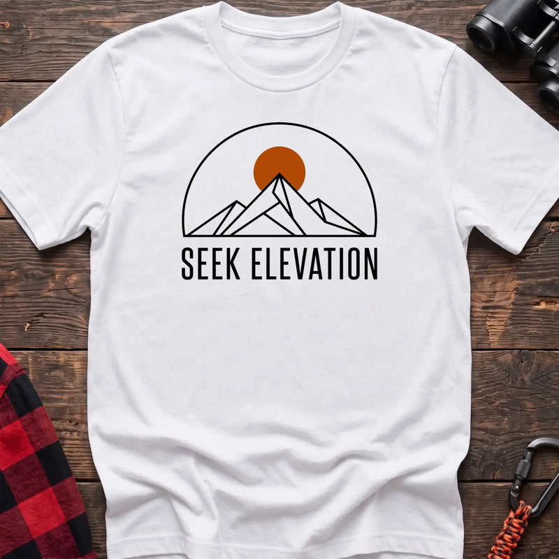 White t-shirt with minimalist mountain and sun graphic reading Seek Elevation