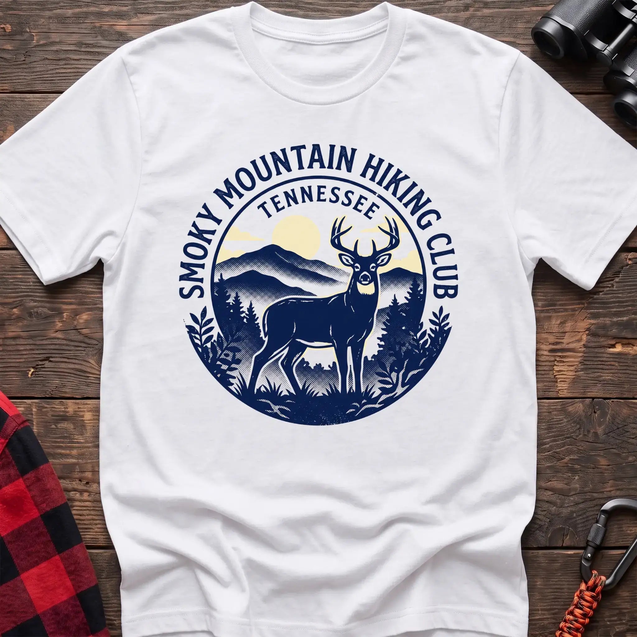 White t-shirt with circular badge graphic of a deer in the mountains reading Smoky Mountain Hiking Club Tennessee