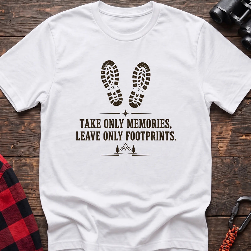 White hiking graphic T-shirt with boot prints and “Take only memories, leave only footprints” trail design