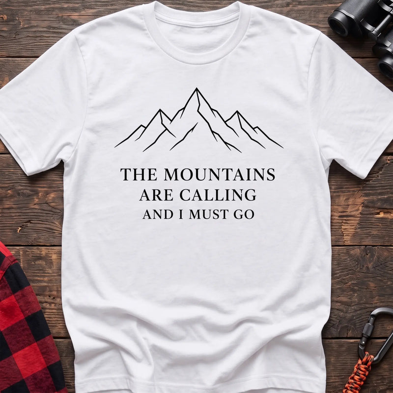 White cotton hiking t-shirt with simple mountain line drawing and "The mountains are calling and I must go" quote