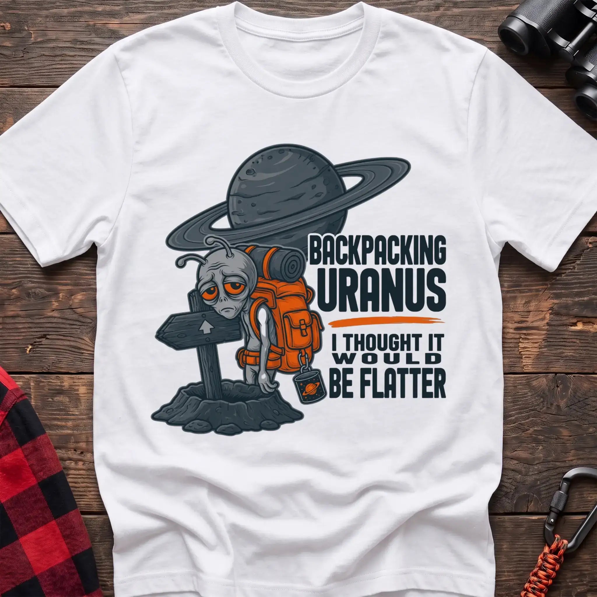 White t-shirt with tired alien backpacker next to a trail sign and the text Backpacking Uranus I Thought It Would Be Flatter