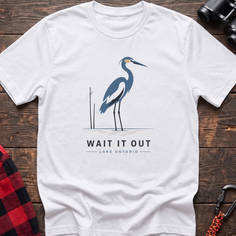 White hiking t-shirt with a blue heron graphic and the text “Wait It Out Lake Ontario”