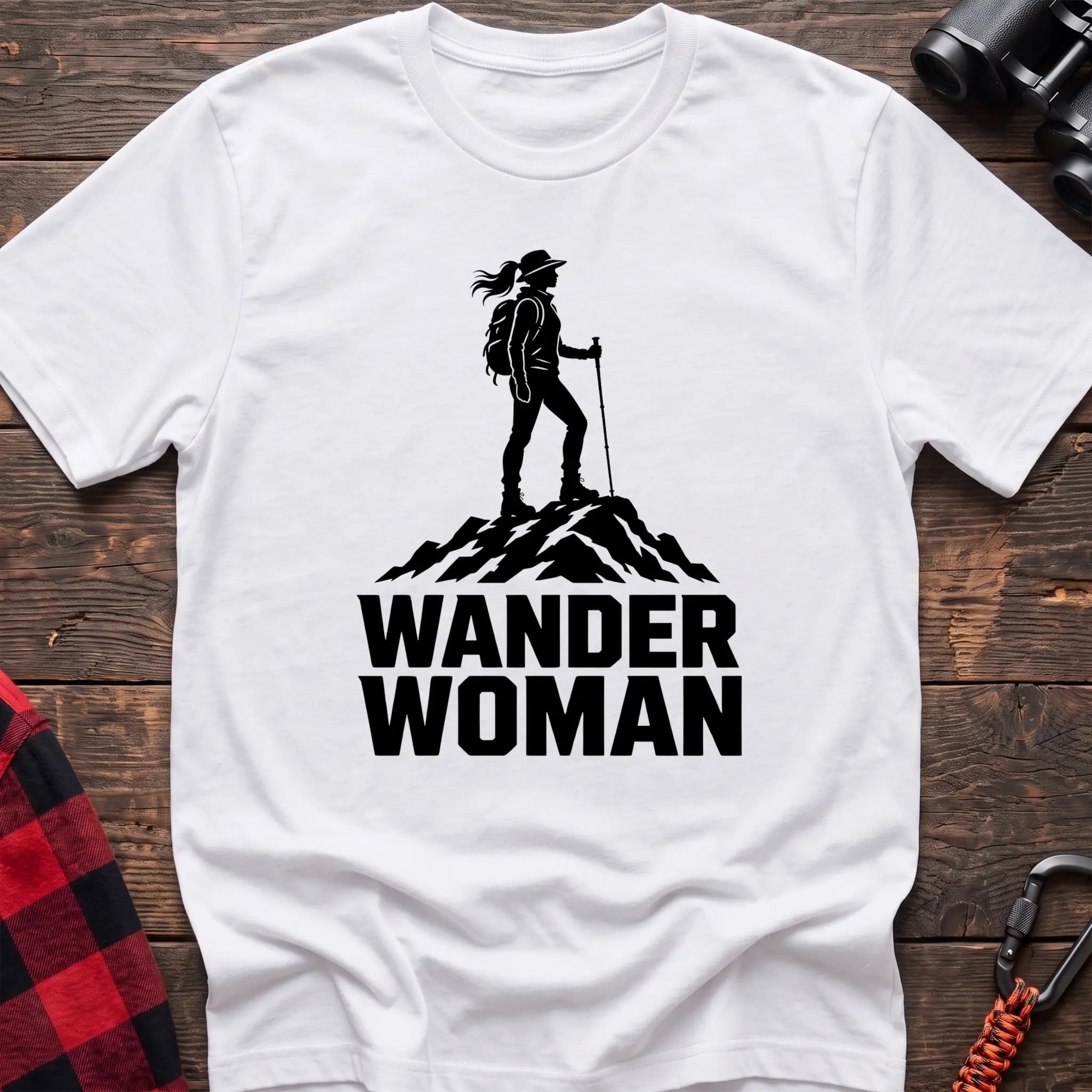 White cotton hiking t-shirt with black silhouette of a female hiker on a mountain peak and bold Wander Woman text