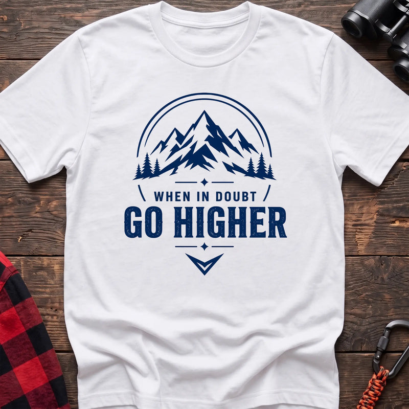 White cotton hiking t-shirt with navy mountain and pine tree graphic and "When in doubt go higher" quote